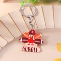 Dettaglio portachiavi tacchino del Ringraziamento in acrilico con scritta Gobble e anello - Stile Tacchino Football (GOBBLE)