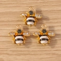 Three golden bee-shaped enamel pendants with black and white rhinestones for DIY jewelry - 10 Pieces Pack / White Wasp