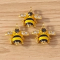 Three golden bee pendants with yellow enamel and sparkling rhinestones for DIY jewelry - 10 Pieces Pack / Yellow Wasp