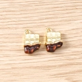 Detailed view of two gold and brown chocolate bar pendants with small rings on wood - 5 Pieces / Chocolate