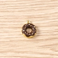Macro view of a chocolate donut pendant charm with gold accents and cream sprinkles - 5 Pieces / Black Donut