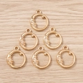 Close-up of golden crescent moon and star charms for DIY jewelry making - Gold Moon
