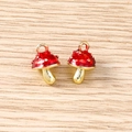 Detailed view of red mushroom charms with white dots and gold metal base for DIY jewelry - 5 Pieces / Red Mushroom