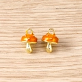 Macro view of handmade mushroom charms with orange enamel and gold metal hanging loop - 5 Pieces / Yellow Mushroom