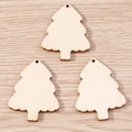 Macro detail of three natural wood Christmas tree pendants with pre-drilled holes for DIY crafts - 10 Pieces Pack / Christmas Tree