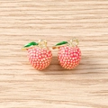 Detail of 3D lychee fruit pendants with pink enamel and gold-plated metal loops - 5 Pieces / Waxberry