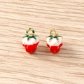 Macro shot of two strawberry pendants with red enamel and golden rings on wood background - 5 Pieces / Creamy Strawberry