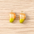 Macro detail of two strawberry charms with realistic texture and golden hanging loops - 5 Pieces / Mango