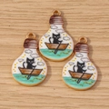 Bulb-shaped enamel black cat on a boat charms with golden metallic finish 3-piece set - 10 Pieces Pack / Bulb Rowing Cat