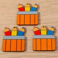 Macro shot of three cartoon wooden pencil pot charms with colorful pencils and pre-drilled holes - Three Pencils / 10 Pieces Pack
