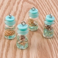 Macro shot of ocean style mini glass drift bottle pendants with tiny shells and glitter - 10 Pieces Pack / Lake Blue