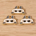 Three cute angry cat metal pendants for DIY jewelry making on a light wood background - 10 Pieces Pack / White Cat