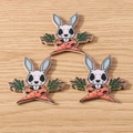 Detailed macro view of punk rabbit and carrot acrylic charms for DIY jewelry making - Carrot Rabbit