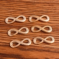 6 pieces of rose gold infinity symbol connectors for DIY jewelry making on wood background - Gold