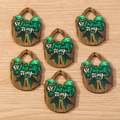 Macro detail of wooden St. Patrick's Day pendants with shamrock and hat designs - 10 Pieces Pack / Bowknot Teardrop