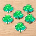 Detail showing six green clover wooden pendants with cartoon illustration style for DIY crafts - 10 Pieces Pack / Clover
