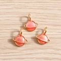 Pink and orange Saturn planet charm pendants with gold alloy base and glitter for DIY jewelry - 10 Pieces Pack / Pink