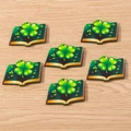 Close-up of green book-shaped clover charms for St. Patrick's Day DIY jewelry making - 10 Pieces Pack / Clover Book