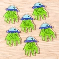 Macro detail of acrylic UFO DIY charms with green beam and Get In Loser slogan - Get In Loser UFO