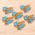 Set of 6 acrylic bird charms with hand-drawn blue doodle design and orange wings - Bird