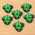 Detail of green suit-shaped wooden St. Patrick's Day shamrock charms on wood background - 10 Pieces Pack / Green Clothes