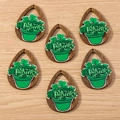 Flat lay of drop-shaped wooden shamrock pendants for St. Patrick's Day accessories - 10 Pieces Pack / Pot Teardrop