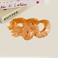 Drachenförmige Haarklammer aus Acetat in perlmuttorange mit goldenen Schuppendetails - Bernstein Orange