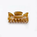 Fashionable mid-sized tortoiseshell acrylic hair claw clip with stylish amber pattern - Caramel color