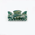 Medium acrylic hair claw clip with green and white marble texture in bow design - Green