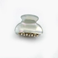 Mini acrylic hair claw clip with pearlescent finish and gold metal teeth in pearl white - Light Green