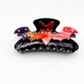 Halloween haarklem zwart met kleurrijke marmeren vleermuis en glanzende strass-steentjes - 10.3cm / Oranjerood