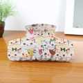 Cute cartoon cat pattern hair claw clip made of resin on a wooden surface - Milky Cat 8.9cm