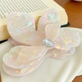 Iridescent flower hair claw clip with crystal detail on an elegant art book - Iridescent Yellow-Large 9.3cm