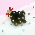 Christmas tree hair clip with black plush material, red bow, and golden star detail - Black