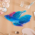 Blue semi-transparent fish-shaped hair claw clip with purple gradient on wood table - Tropical Fish Style (Style 5)