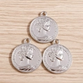 Detailed macro view of silver Roman coin pendants with Queen Elizabeth engraving - 10 Pieces/Pack (Large) / Silver
