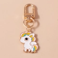 Detail of a white enamel unicorn keychain with colorful mane and gold-plated lobster clasp - Unicorn