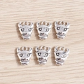Detail of six retro silver bull head pendants with relief texture for DIY jewelry making - Cartoon Bull Head / 20 Pieces Set / Antique Silver