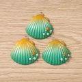 Detailed view of gradient shell pendants with golden starfish and white pearls for DIY jewelry - 5 Pieces / Green