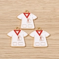 Detailed macro view of white enamel medical scrub pendants with gold metal edges - 10 Pieces Pack / Nurse Uniform