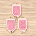 Détail de breloques de sac de perfusion rose avec bords dorés pour bijoux DIY - Lot de 10 / Poche de Perfusion Rose
