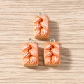 Close-up of three artificial brioche bread pendants with silver rings on wood surface - Hand-shredded Bread / 10 Pieces Pack