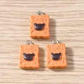 Detail showing three rectangular bread charms with bear motifs and silver loops - Bear Bread / 10 Pieces Pack