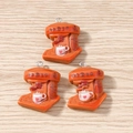 Macro shot of orange resin coffee machine charms with heart cups for DIY jewelry making - 10 Pieces Pack / Coffee Maker