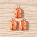 Detail of three baguette bread resin charms with silver rings on wood surface - Fluffy Bread / 10 Pieces Pack