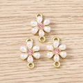 Macro detail of floral jewelry connectors with white petals and pink center rhinestone - Gold Artificial Pearl Flower