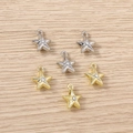 Macro shot of gold and silver star pendants with small crystal centers for jewelry - Mixed Color Engraved Star / 5 Pieces