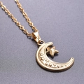 Close-up of 18k gold plated stainless steel crescent moon and star pendant detail - Pendant Necklace / Gold