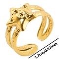 Detail view of adjustable gold star ring with double band structure and embossed texture - Gold