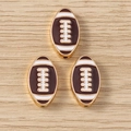 Macro detail of three alloy American football charms with brown enamel and gold plating - 10 Pieces Pack / Brown and White